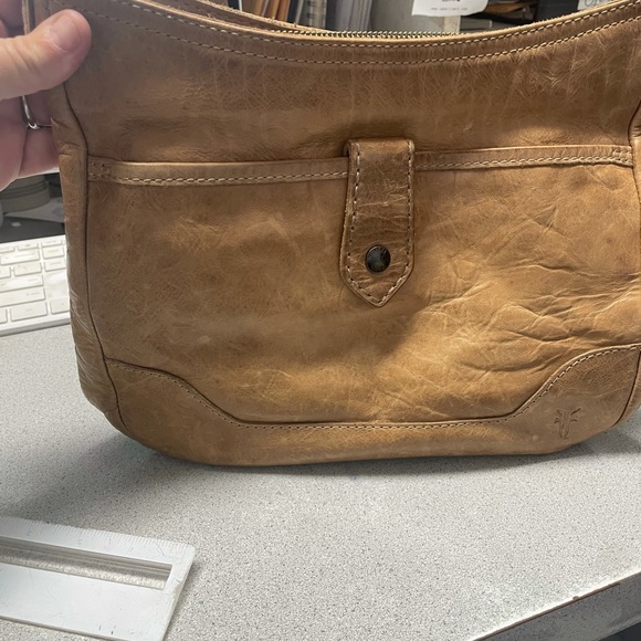 Used Frye crossbody purse. Tan in color good condition - Picture 2 of 4